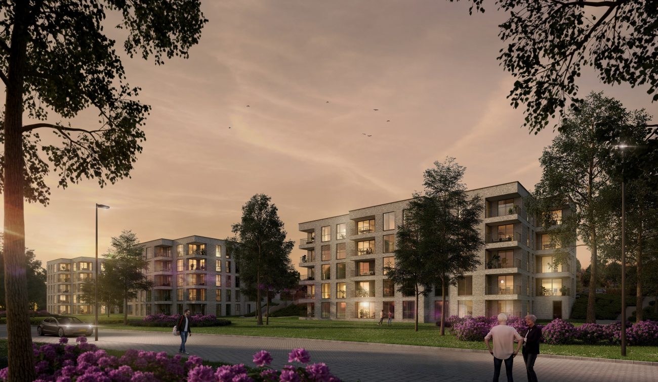Impressie van het nieuwbouwproject De Jonkvrouw in Geldrop, met warme avondzon die de gevel van het appartementencomplex verlicht.