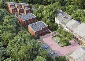 Impressie nieuwbouw Kovelaar Utrecht met baksteenblokken, zonnepanelen, groene hof en parkeervakken.