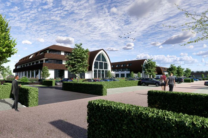 Impressie van de voorzijde van het nieuwgebouwde Van der Valk Exclusief Hotel Gouden Leeuw in Voorschoten, gezien van een afstand met zicht op het volledige gebouw en de omgeving.