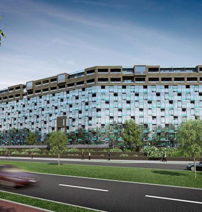 Impressie renovatie en optoppen flatgebouwen Breda: hoge gevel met glas, balkons en groen aan weg