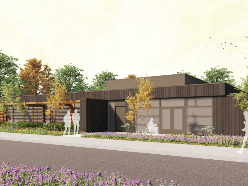 Impressie van schuin zijaanzicht van een hospice en logeerhuis met daarvoor silhouetten om de schaal aan te geven